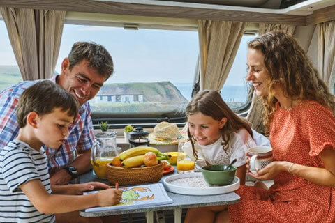 Family enjoying a trip away in their touring caravan