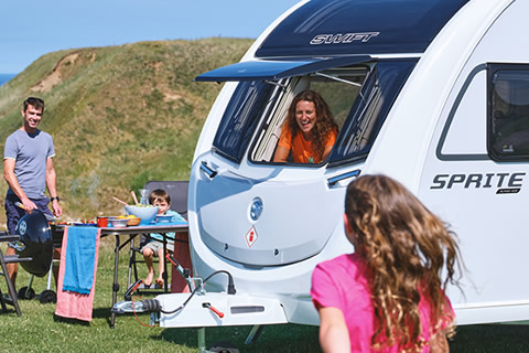 A family enjoying a summer touring holiday