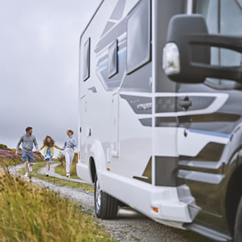 Family approaching their motorhome