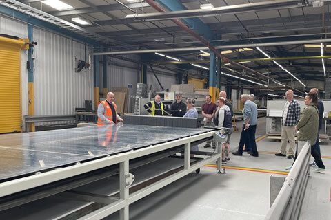 Attendees on an exclusive factory tour at Swift